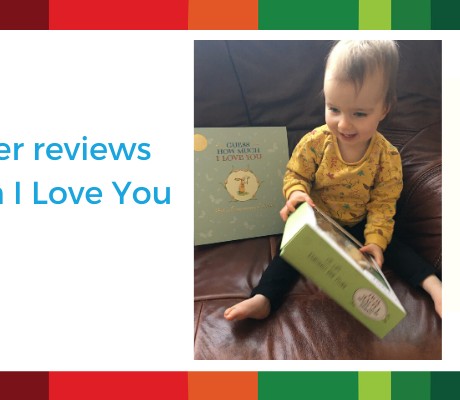 Picture of baby reading Guess How Much I Love you board book and toy